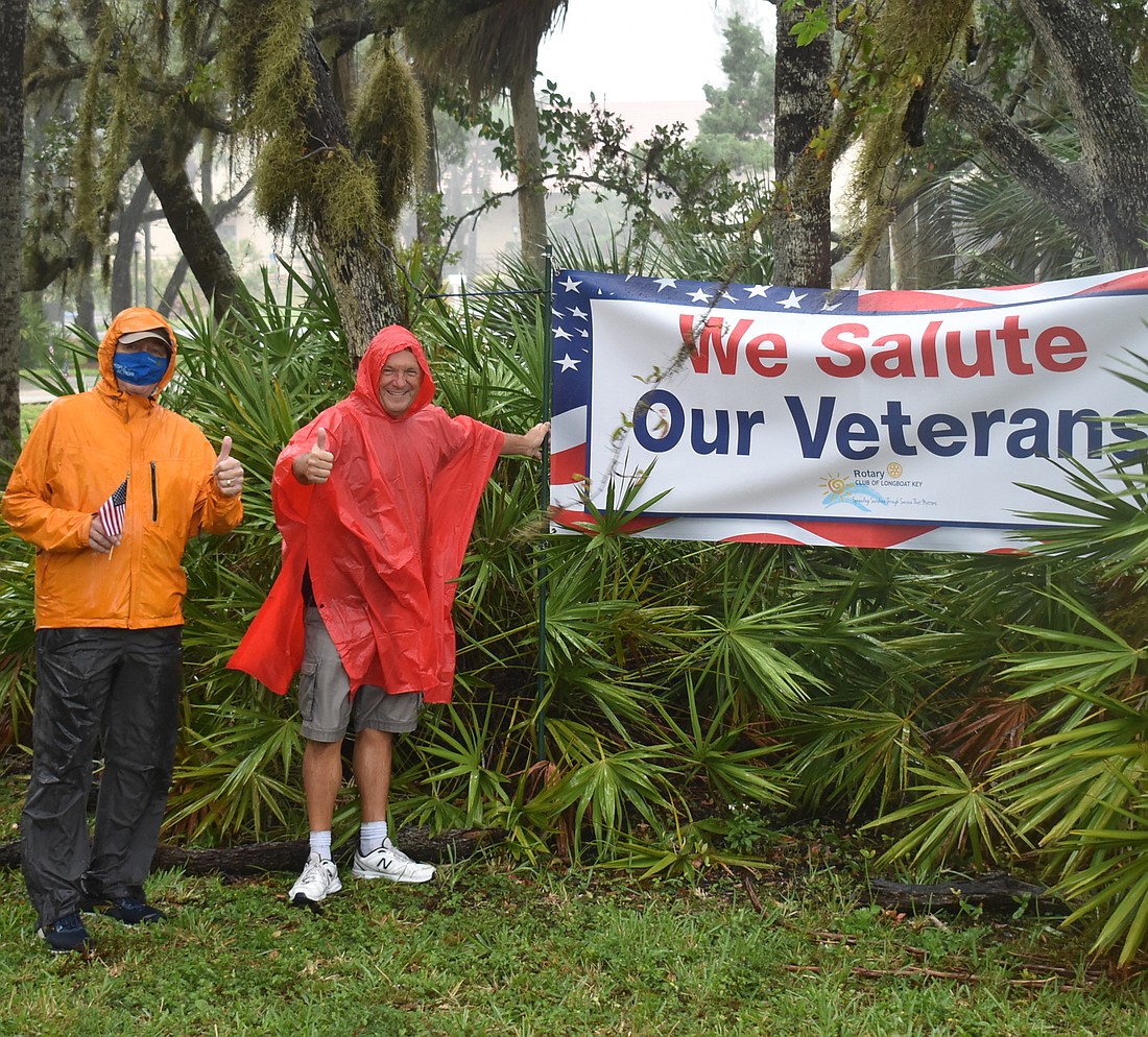 Jack Rozance and Scott Weusthoff at the 2020 Veterans Day celebration, which was hampered by the arrival of Tropical Storm Eta. File photo.
