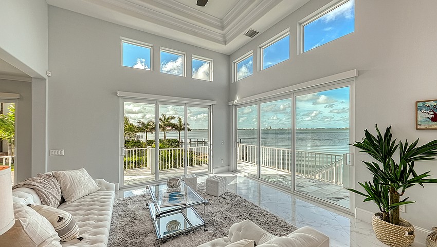 Floor to ceiling windows overlook the bay view. (Photo courtesy Brandy Shelton, Coldwell Banker)