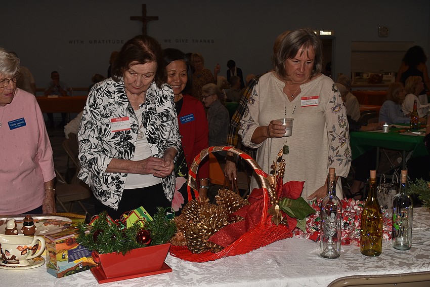 Before the luncheon, women wandered to look at the Christmas Bazaar items.