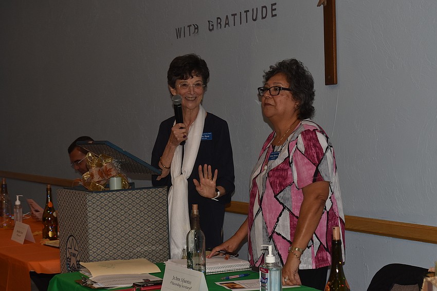 Clara McGonigle and JoAnn Sifuentes asked members to take their seats.