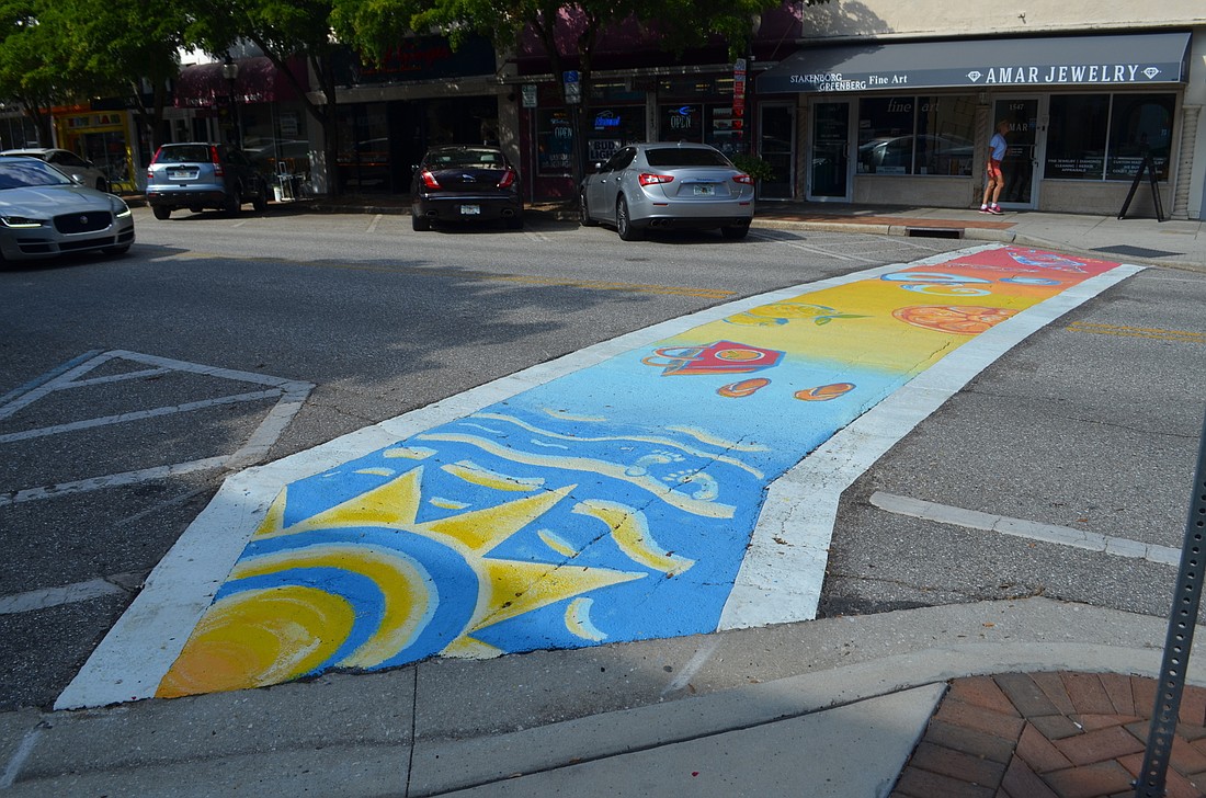 Downtown Improvement District board members were critical of the city&#39;s previous efforts to paint mid-block crosswalks, suggesting the artwork was in conflict with the goal of clearly marking the crossing. File photo.