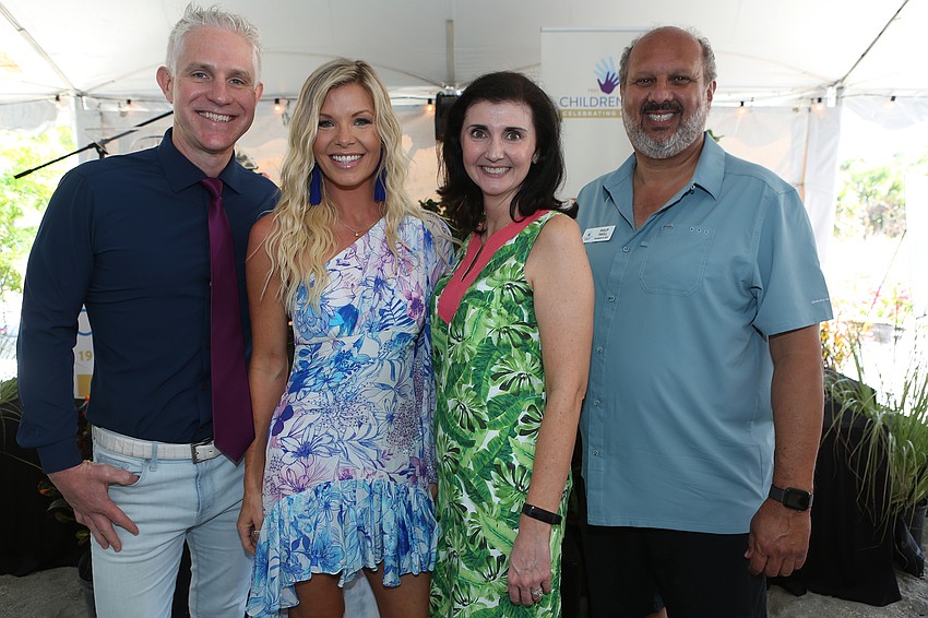 Matt and Krystel Beall with Jessica Rogers and President and CEO Philip Tavill