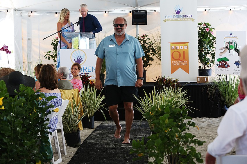 President and CEO struts down the walkway.