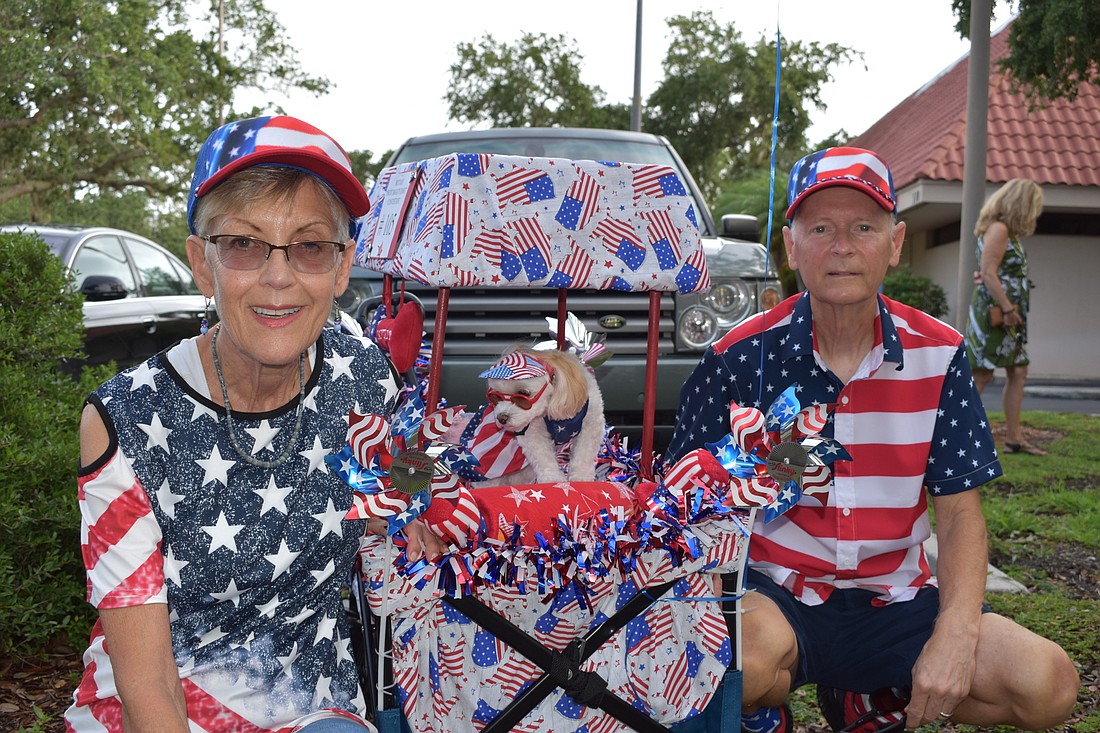 Nancy and Tony Roberts&#39; dog Biscuit was decked out in Fourth of July attire at Longboat Key&#39;s Freedom Fest. File photo