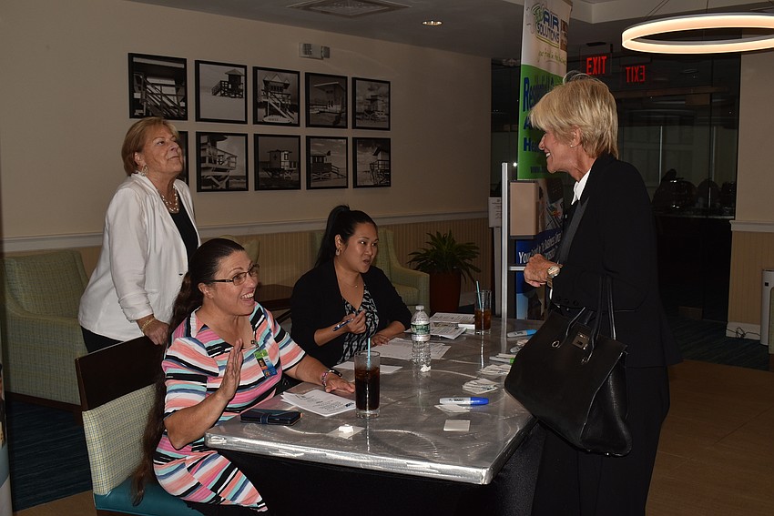 Gail Loefgren, Debbie Shaffer and Caitlyn Zaborowski greet Nicci Kobritz.