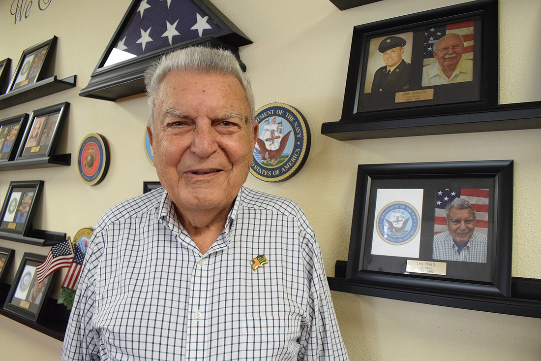 Retired Navy Capt. Leo Hyatt&#39;s photo hangs on a wall honoring veterans at Cypress Springs Gracious Retirement Living. Hyatt served from 1957 to 1986 and spent five years as a prisoner of war during the Vietnam War.