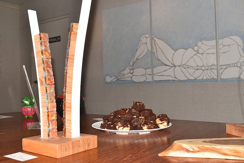 A plate of homemade brownies was on the table amidst Olin's art.