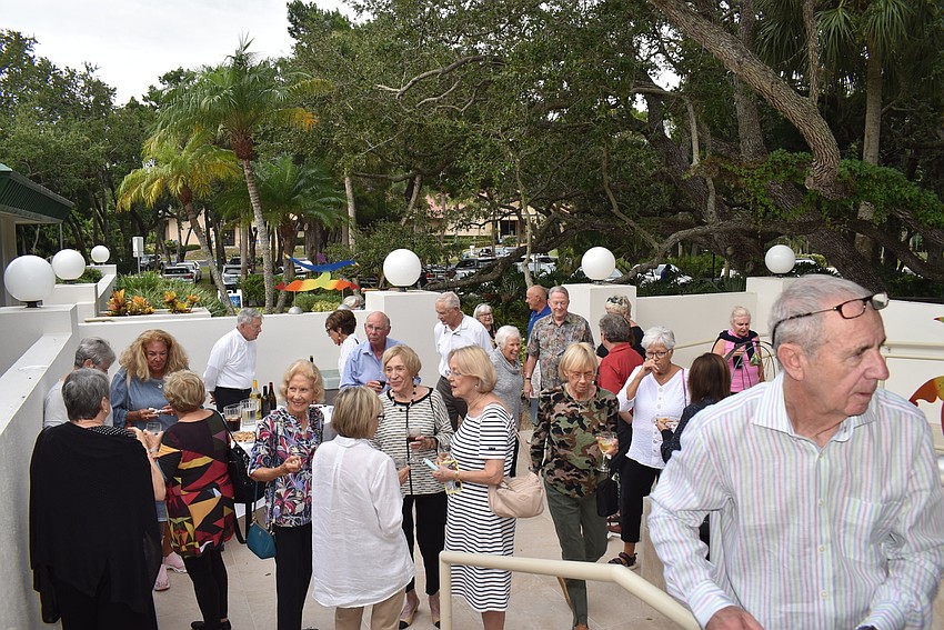 Attendees gathered outside in the church's recently renovated courtyard.