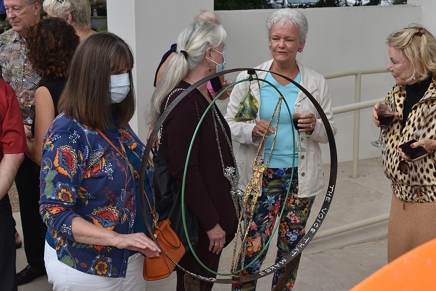Deb Genua set a sculpture spinning. Olin said all her work was 