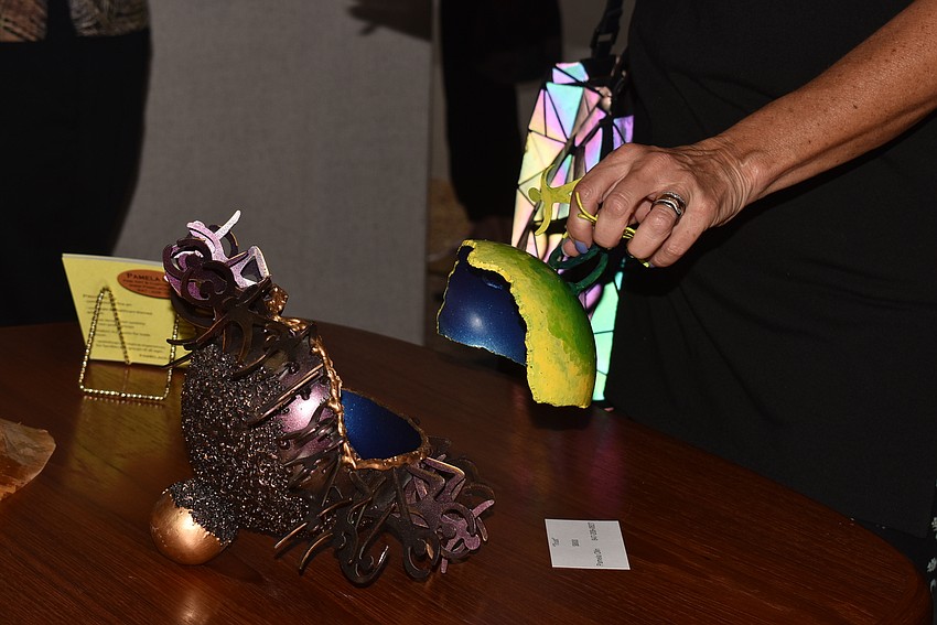 Olin's sister, Andrea Feldmar, picks the lid off a fantasy seed.