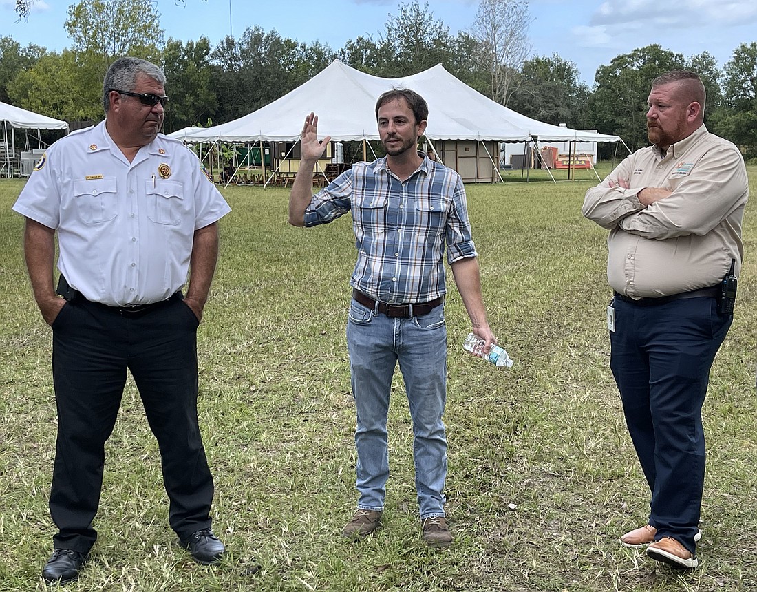 Sarasota Medieval Fair President Jeremy Croteau (center) leads East Manatee Fire Marshal Alex Onishenko (left) and Public Safety Director Jacob Saur (right) on a tour of the Medieval Fair site on Oct. 29.