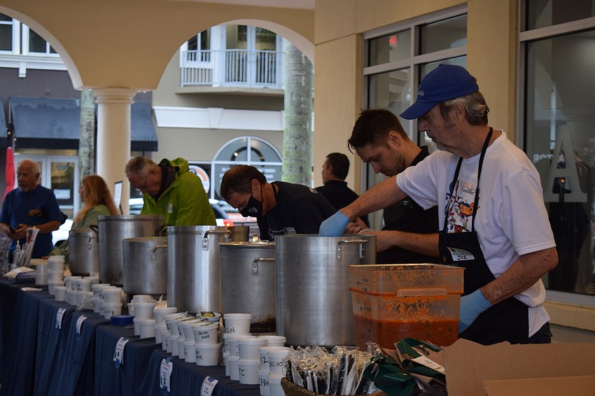 Country Club East's Gary Corson, Heritage Harbour's Mike Neville, Metro Diner's Managing Partner Justin Gorrell and Sabal Harbour's Joe Angers serve soup during Empty Bowls.