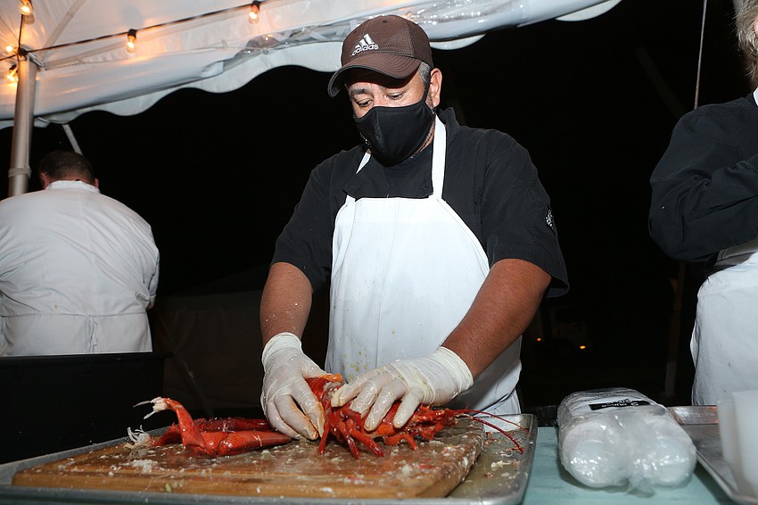 Ernest Perez prepares lobster for the guests.