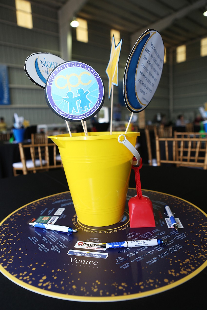 Each table had a colorful bucket-and-sand arrangement.