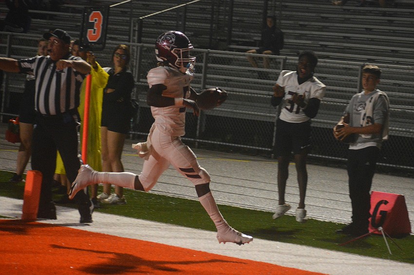 Braden River quarterback Bryan Kearse high steps into the end zone.