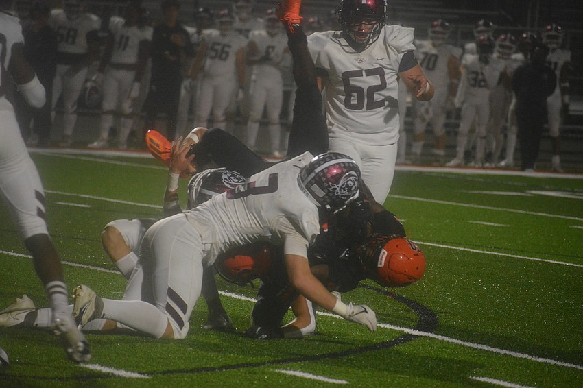 Braden River linebacker Aidan Dangler (3) lays a big hit on Sailors wide receiver TJ McKay.