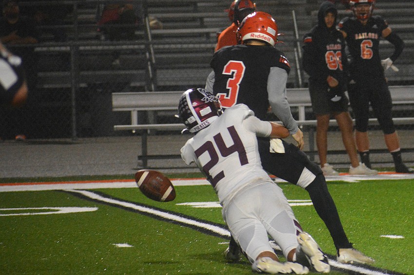 Braden River linebacker Tanner Wolfe (24) gets a strip sack on Sailors quarterback Lance Trippel.