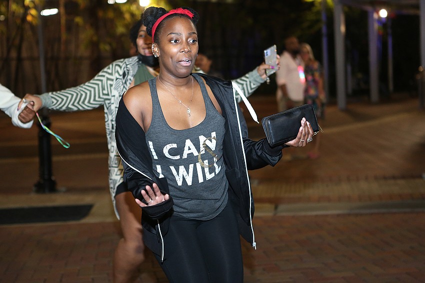 Marta McKinnon with Westcoast Black Theater Troupe dances along.