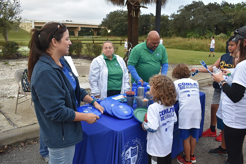 Several vendors gave away items in the midway at Saturday's Fort Hamer Bridge Run in Parrish.
