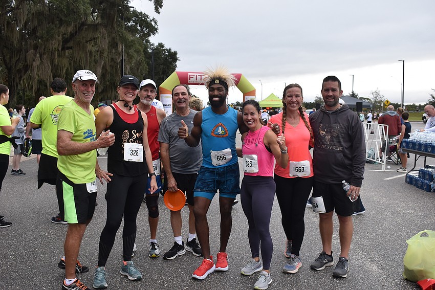 A group of runners relax after finishing Saturday's Fort Hamer Bridge Run. Pictured are Glen Murrhead, Julie Metcalf, Steve Morse, Dennis Gallo, Alvin Ducre, Lilliann Reyes, Holly Parton and William Parton.