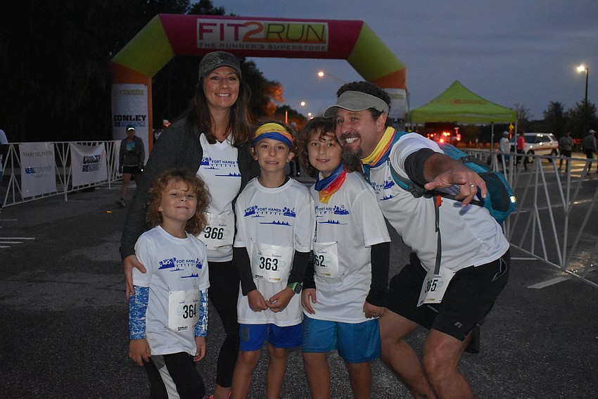 The Cash family from Parrish gets fired up to run Saturday morning's Fort Hamer Bridge Run. Pictured, from left to right, are Cody Cash, Deb Cash, Colson Cash, Quincy Cash and Cary Cash.