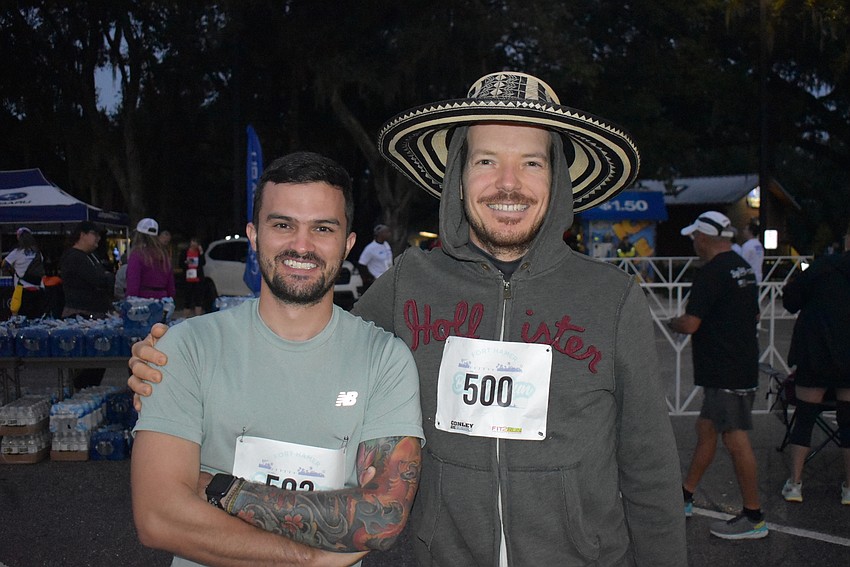 The large hat worn by Tampa's Nicolas Restrero didn't slow him down in Saturday's Fort Hamer Bridge Run. He was running with Hernan Montoya (left), who was on vacation from Colombia.