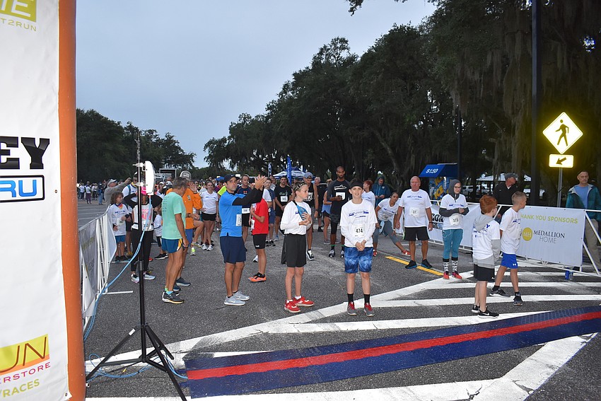 Runners gather at the starting line just prior to the start of Saturday morning's Fort Hamer Bridge Run.