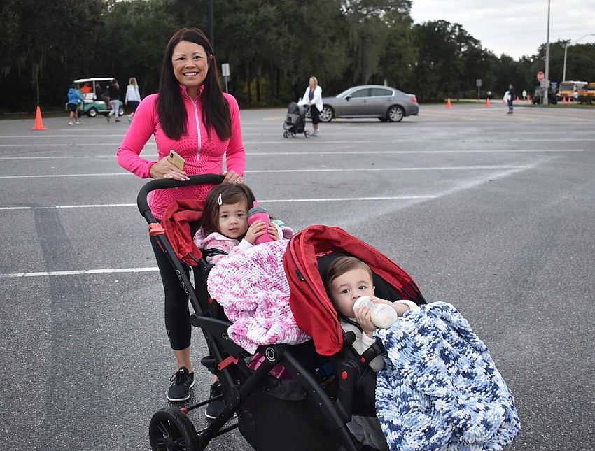 Loany Luehrs woke Lucie , 2, and Keith Luehrs Jr., 1, early to cheer on dad Keith Sr. in Saturday's Fort Hamer Bridge Run.