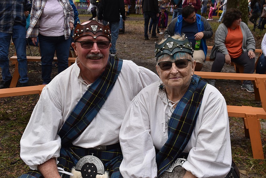 Paul and Lora Jackomia of Port Charlotte take in a performance by Blue Sky Pipes and Drums at the Medieval Fair.