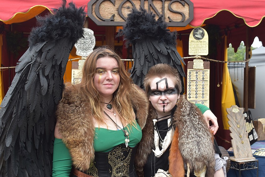 Sylvie Howard (left) and Taylor Callander, both of Sarasota, take a break from looking around the vendor tents at the Medieval Fair on Saturday.