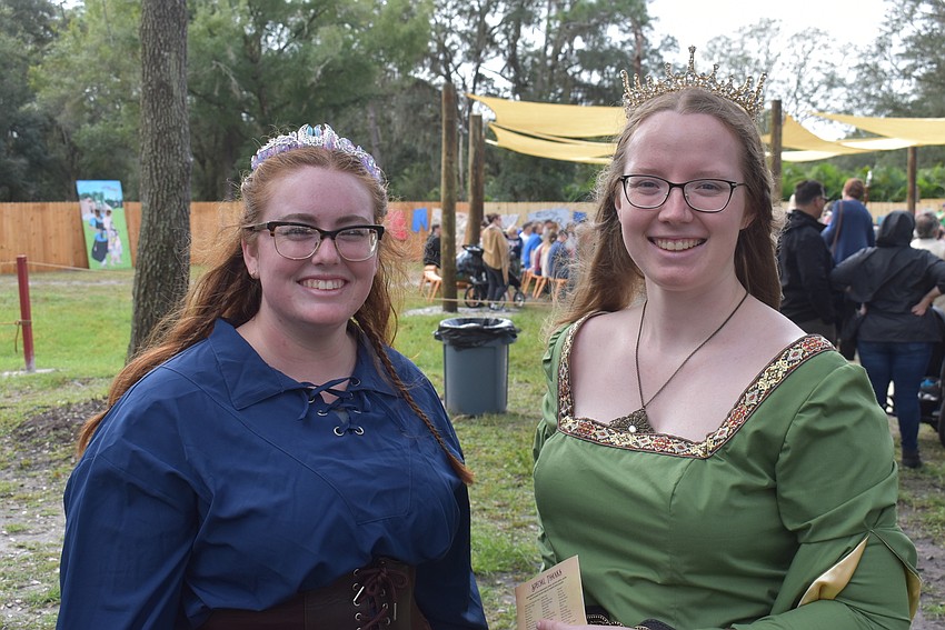 Grace Townsend (left) and Faith Forrest, both of Sarasota, show off their new tiaras at the opening day of the Sarasota Medieval Fair.