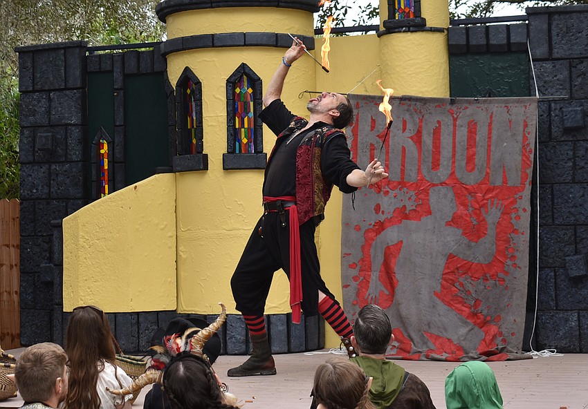 Broon, a performer at the Sarasota Medieval Fair, wows the crowd by 