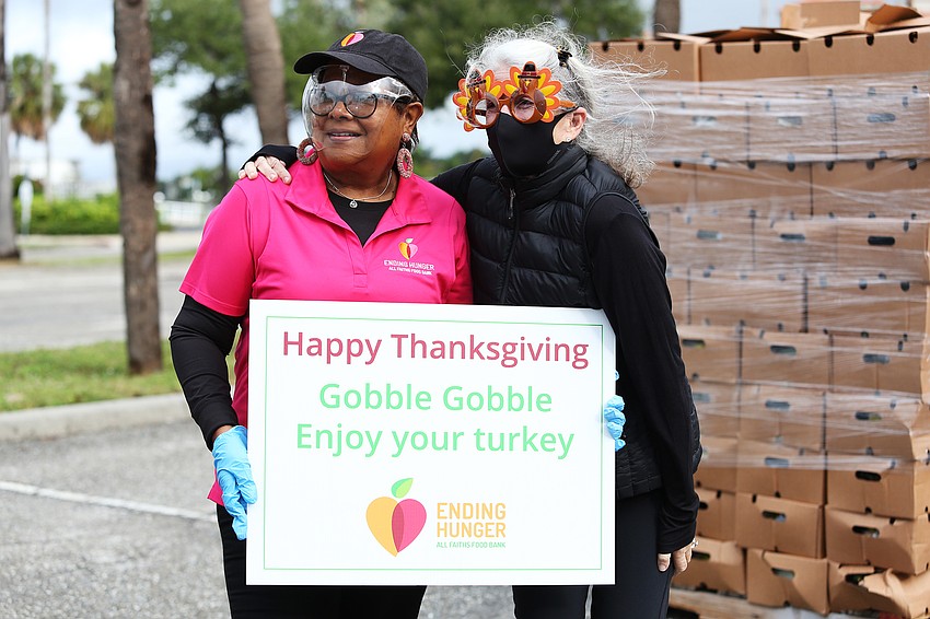 Aundria Castleberry and Marcy Klein bring cars on over.