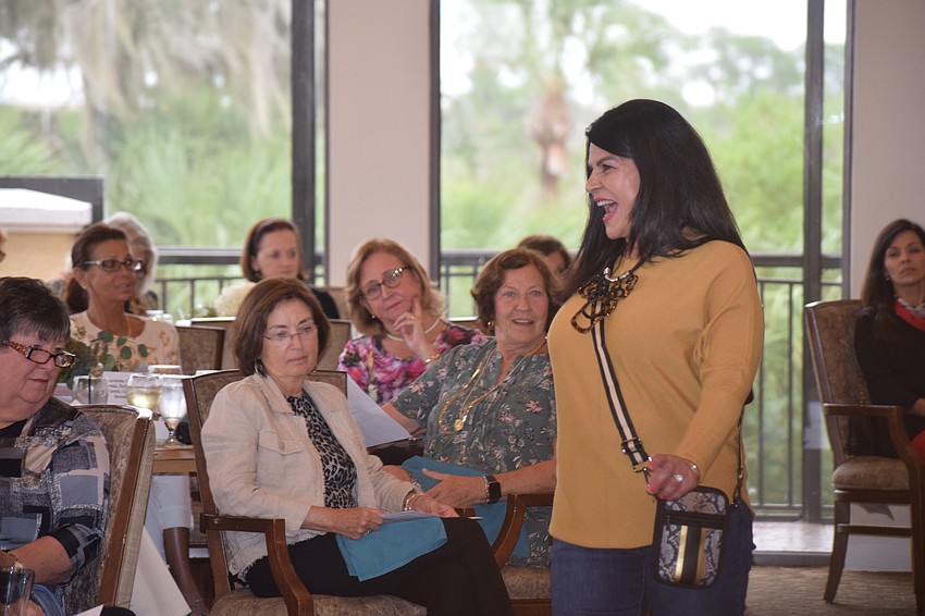 Zohreh Ambrose shows those in attendance at the Waterlefe Golf and River Club that mustard is the 