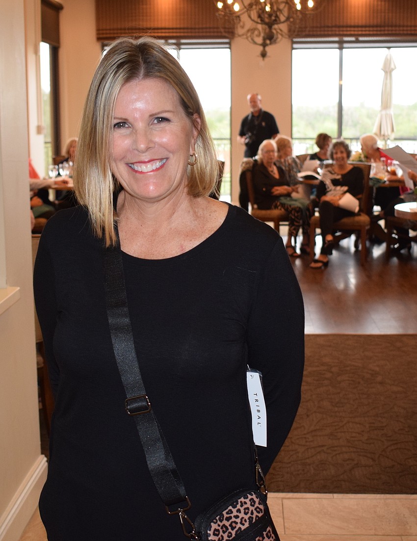 Jodi Carroll gives a smile after she finished walking the runway.