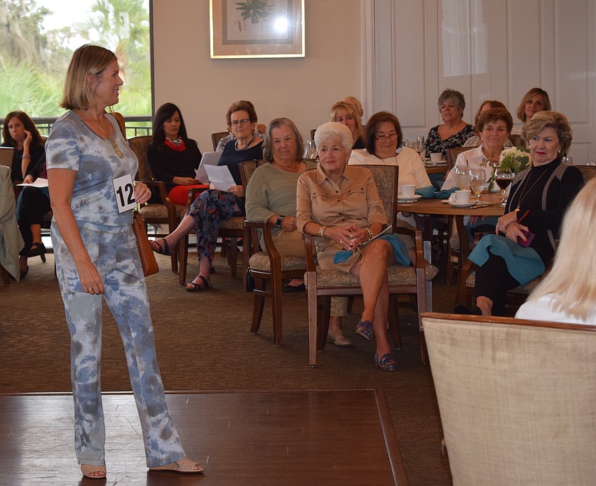 Amber Browne plays to one section of the room as she models.