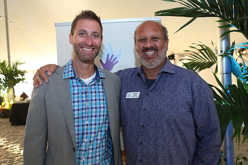 Keith Johnson and President and CEO Phil Tavill