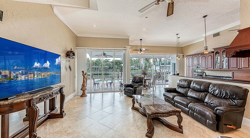 The kitchen overlooks an informal living space.