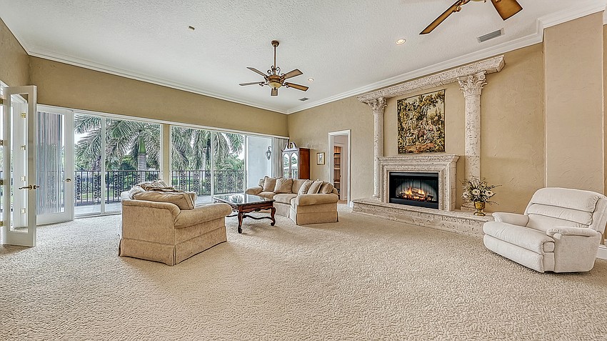 The master bedroom includes a fireplace in the sitting area.