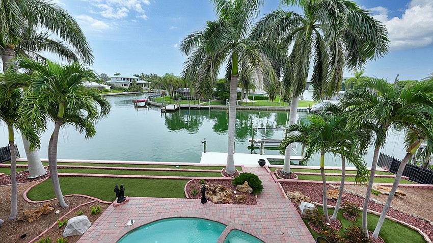 The spa and heated pool overlook Bird Key's canals.