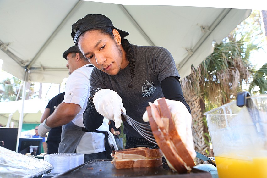 Demetrius Davis serves up sandwiches