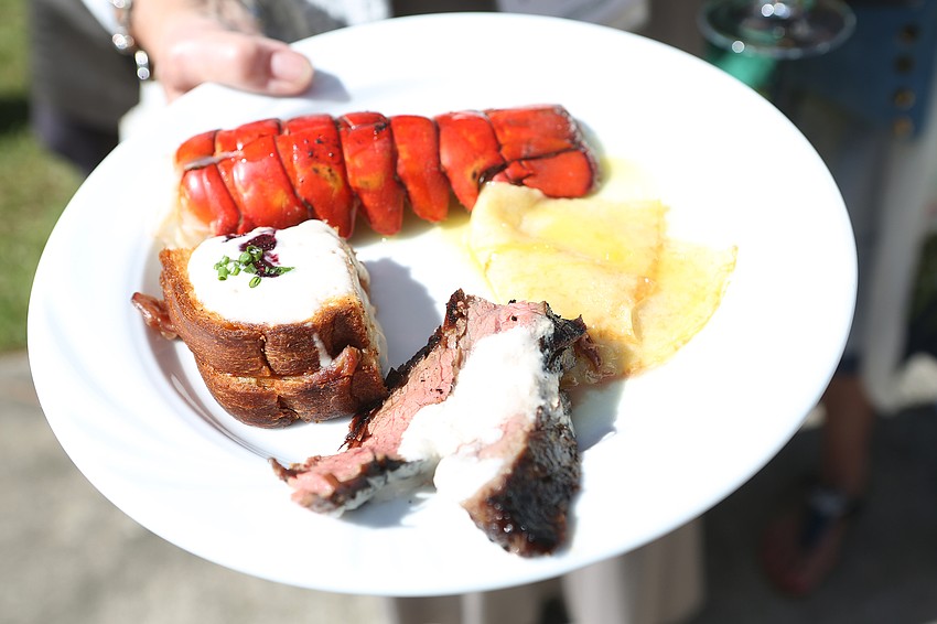 Guests pick up lobster and other dishes.