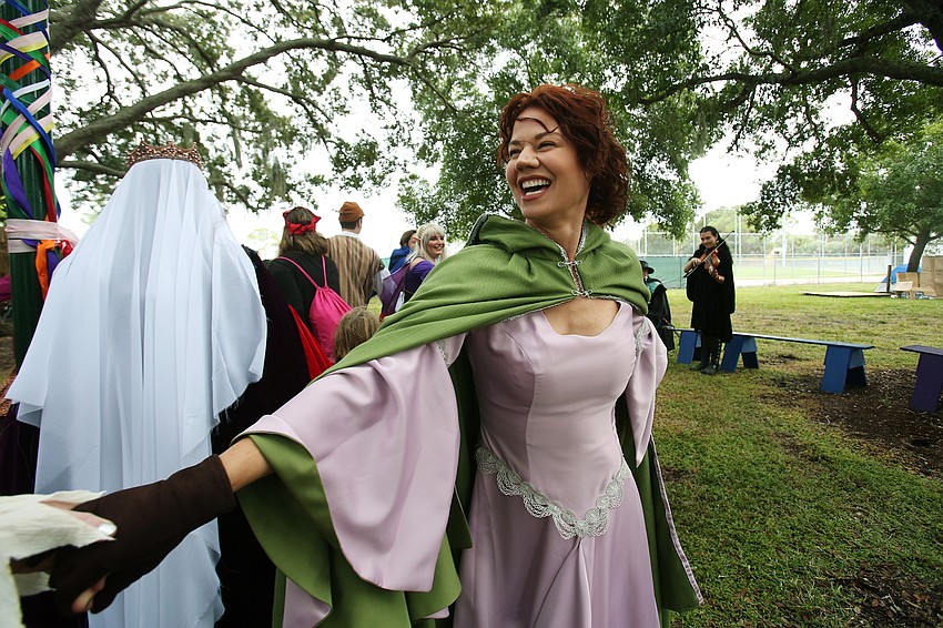 Cara Noel runs along as Maid Marian.