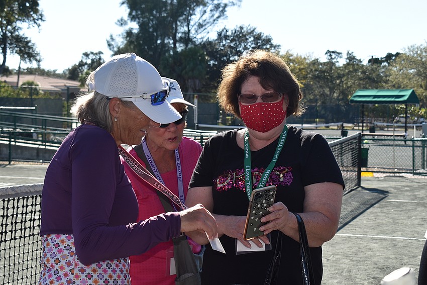 Tamara Wright and Chris Goodwin watch a ballroom dancing video of Bryanna Schmidt by mom Rosanna Schmidt.
