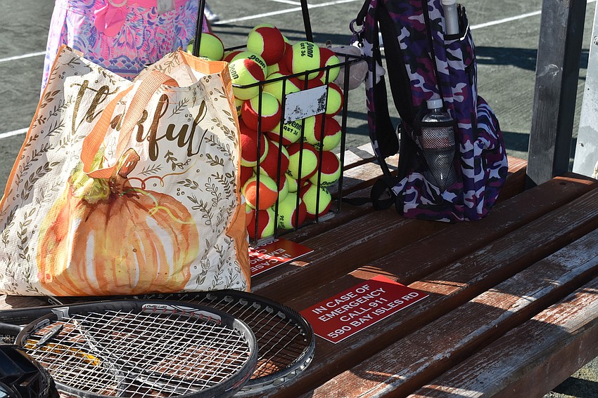 Tennis accessories wait on the sidelines.