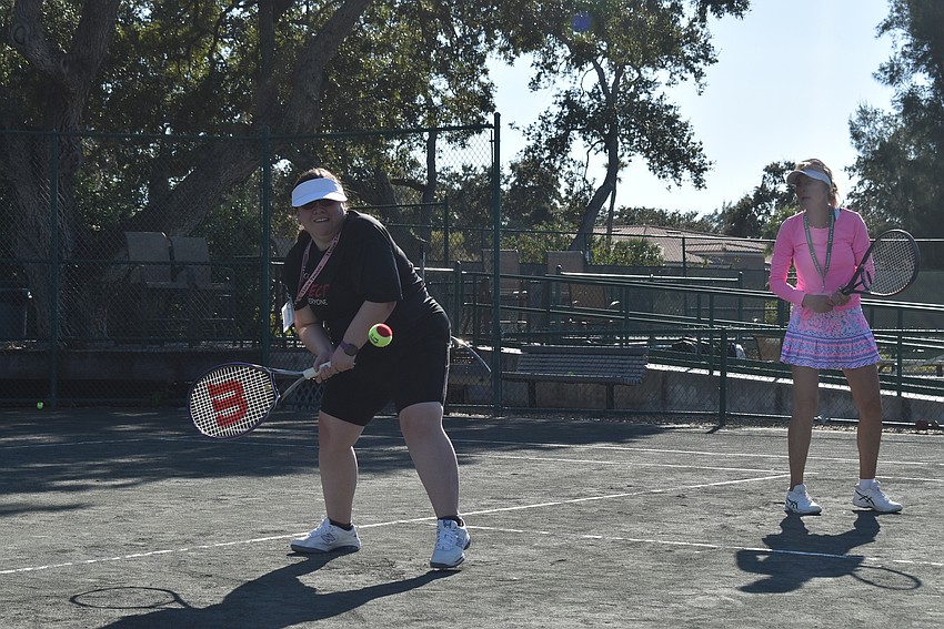 Bryanna Schmidt and Brenda Terihay run for a ball.