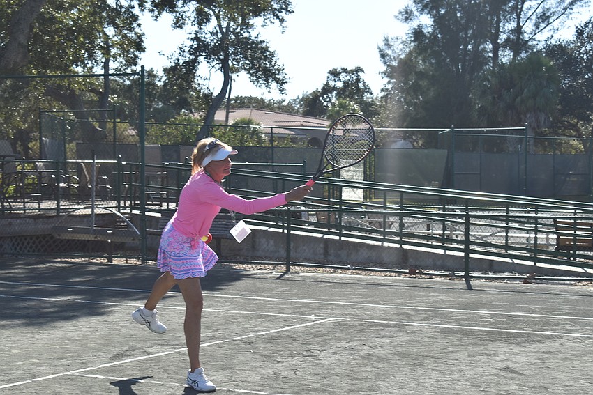 Brenda Terihay swings for a ball.