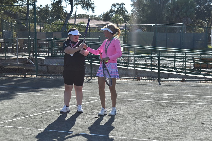 Bryanna Schmidt and Brenda Terihay readjust after a point.