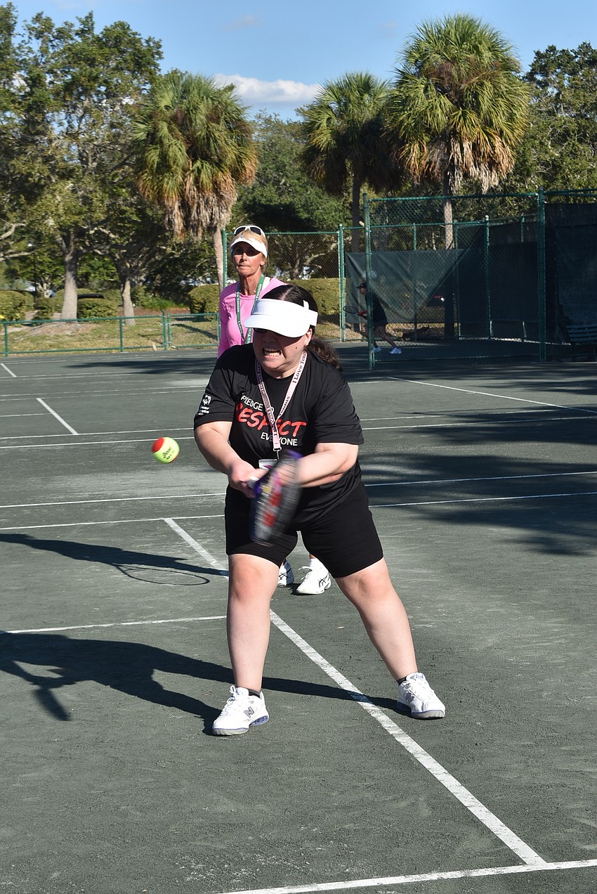 Bryanna Schmidt swings for a ball.