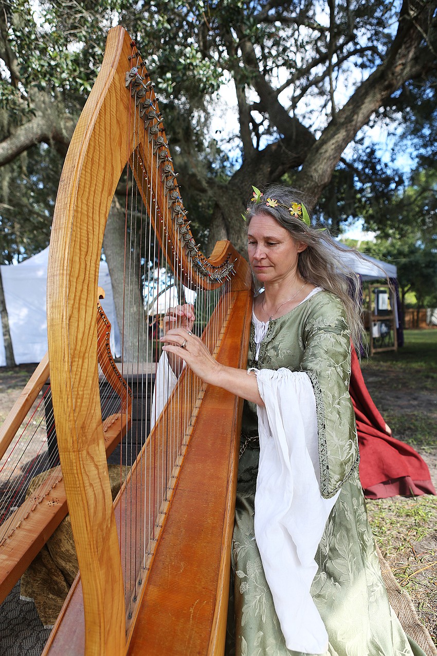 Kathleen Finngan plays the harp.